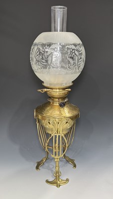 Lot 656 - An Art Nouveau brass oil lamp, Baxendale & Co.,...