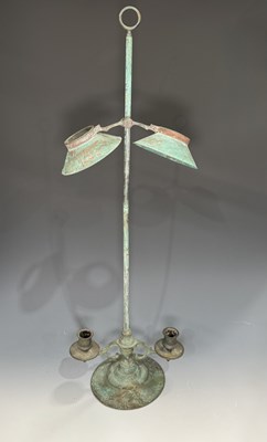 Lot 226 - A verdigris adjustable twin-arm candelabra...