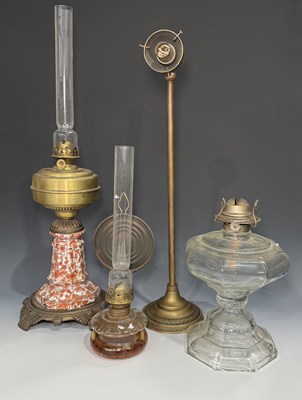 Lot 663 - An oil lamp with moulded glass reservoir,...