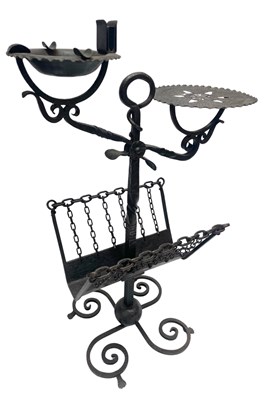 Lot 536 - A wrought iron stand, formed as if to be a...