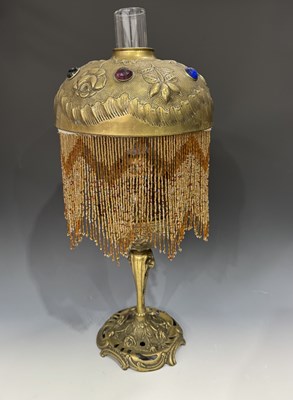 Lot 621 - An Art Nouveau style brass oil lamp, with a...