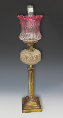 Lot 667 - A Victorian oil lamp with graduated pink,...