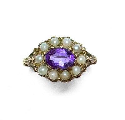 Lot 485 - A 9ct gold amethyst and split pearl cluster ring