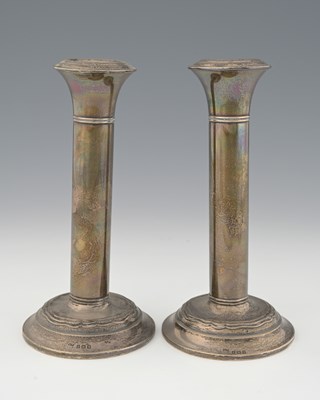 Lot 302 - A pair of George V silver candlesticks, each...