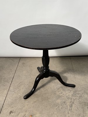 Lot 734 - A 19th century black lacquered tripod tilt top...