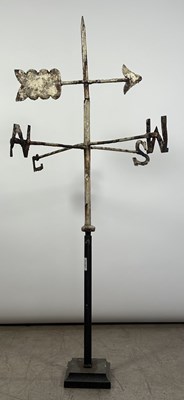 Lot 797 - A white painted cast iron whethervane, mounted...