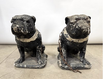 Lot 786 - A pair of cast stone bulldog garden statues,...