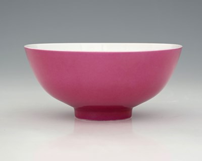Lot 352 - A Chinese monochrome puce glazed bowl,...