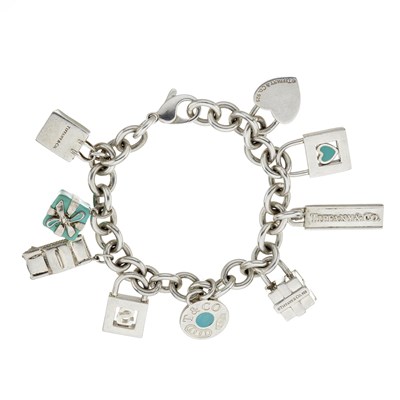 Lot 129 - Tiffany & Co., a silver blue enamel charm bracelet