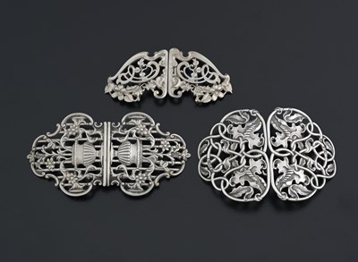 Lot 434 - Three silver buckles, comprising two cast...