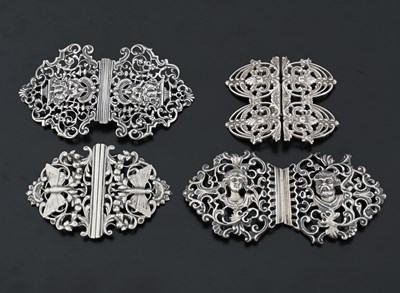 Lot 438 - Four cast silver buckles, one example by...