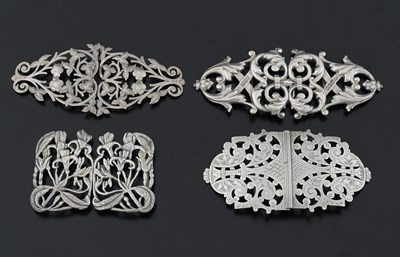 Lot 445 - Four silver buckles, one cast example by...