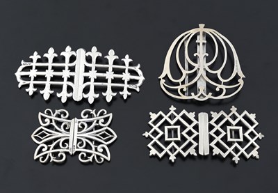 Lot 448 - Four twentieth-century silver buckles, one by...