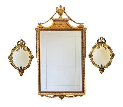 Lot 705 - A pair of oval gilt metal mirrors, floral...