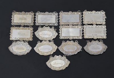 Lot 262 - Thirteen Elizabeth II silver wine labels, six...