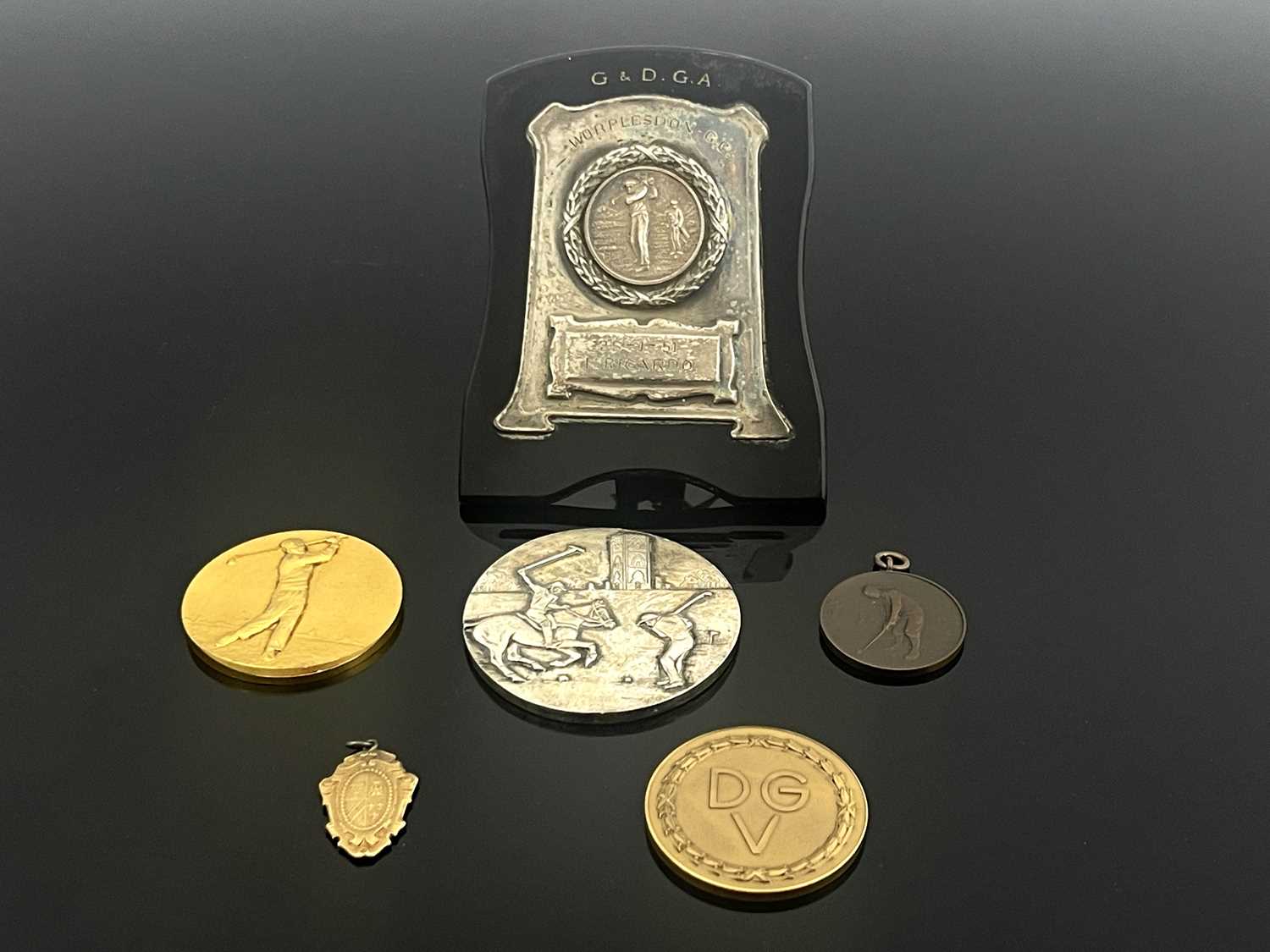 Lot 389 - International golfing medals, a yellow metal...