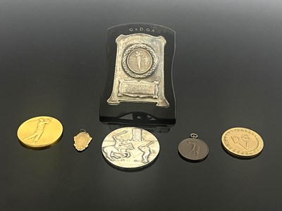 Lot 389 - International golfing medals, a yellow metal...