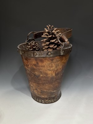 Lot 261 - A brass studded leather bucket, steel rim with...