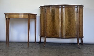 Lot 757 - A serpentine fronted walnut commode, book...