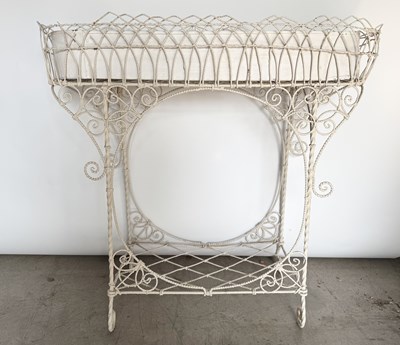 Lot 794 - A white painted wirework planter stand with...