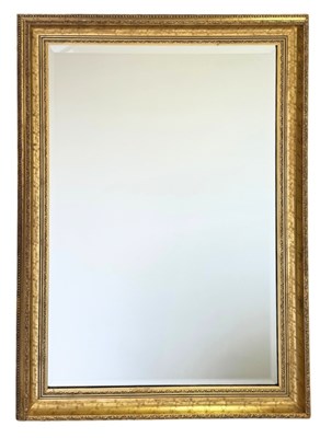 Lot 707 - A large wall mounted water gilded mirror,...