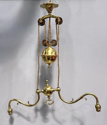 Lot 568 - A brass rise and fall light fitting, with twin...