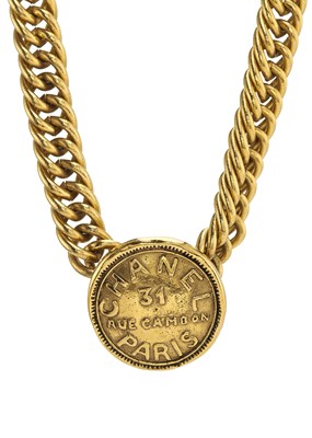 Lot 349 - Chanel, a vintage gold-plated Rue Cambon Coin Charm choker.