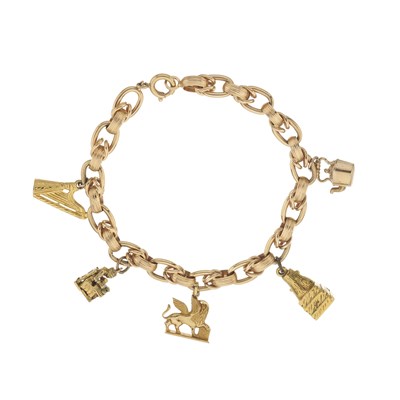 Lot 64 - An 18ct gold charm bracelet