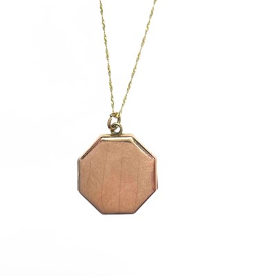 Lot 433 - A yellow metal locket pendant, with 9ct gold chain