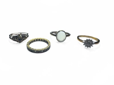 Lot 399 - Four yellow metal gem-set rings