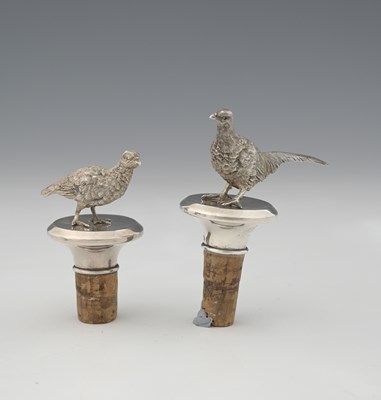 Lot 184 - A pair of Elizabeth II silver bottle stoppers,...