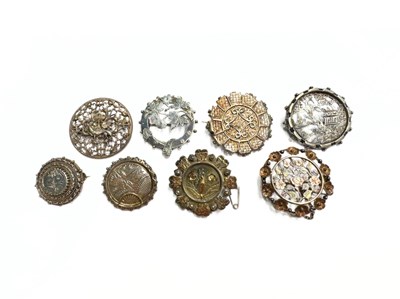 Lot 483 - A selection of eight silver and white metal brooches