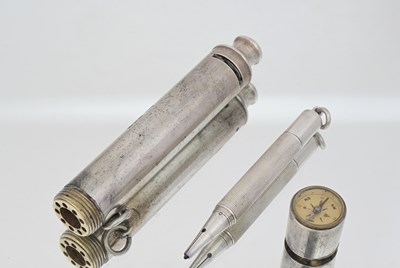 Lot 348 - A George V combination silver whistle, compass,...
