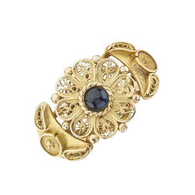 Lot 189 - A gold sapphire floral dress ring
