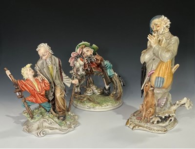 Lot 160 - A collection of three Capodimonte figure...