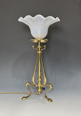 Lot 668 - An English Arts & Crafts brass table lamp, the...