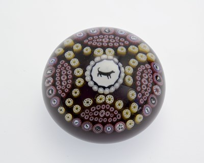 Lot 369 - Baccarat, a dog silhouette millefiori glass...