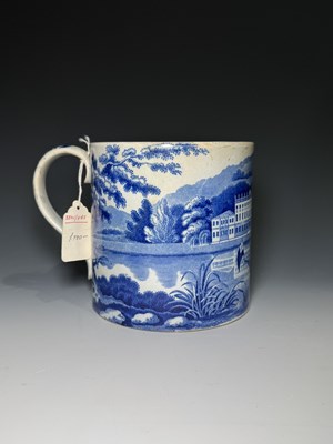 Lot 140 - A pearlware porter mug printed in blue with...