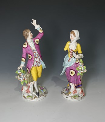 Lot 155 - A pair of painted porcelain male and female...