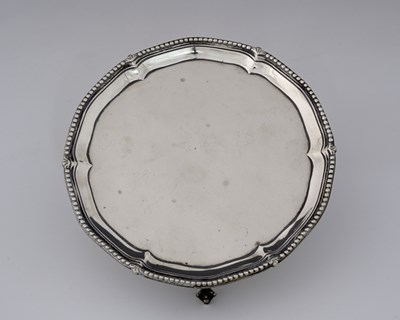 Lot 319 - A George III silver waiter, with beaded edge...