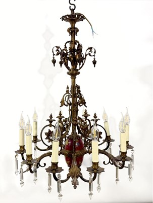 Lot 679 - A patinated gilt-bronzed metal ten-arm...