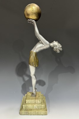 Lot 166 - An Art Deco style figure of a bare-chested...