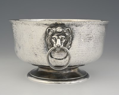 Lot 344 - An Edwardian Arts and Crafts silver punch bowl,...