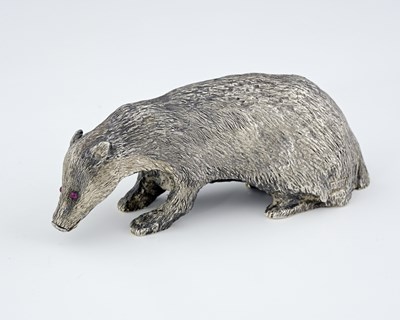 Lot 194 - An Elizabeth II cast silver model of a badger,...