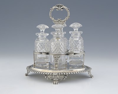 Lot 132 - A George IV silver four-bottle cruet stand,...