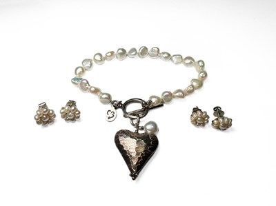 Lot 384 - Claudia Bradley, a silver pearl bracelet and two pairs of pearl earrings