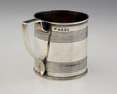 Lot 111 - A George III silver reeded mug, with armorial...