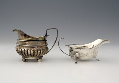 Lot 214 - A nineteenth-century silver milk jug, with...