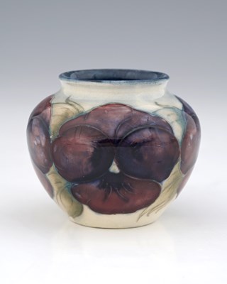 Lot 683 - William Moorcroft, a small Pansy on white vase,...
