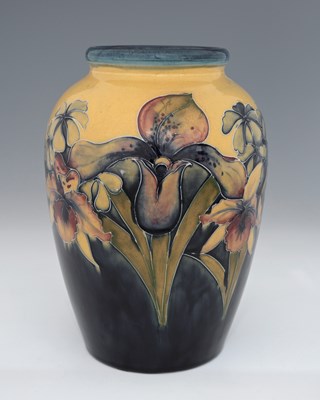 Lot 534 - William Mooorcroft, an Orchid on Ochre vase,...